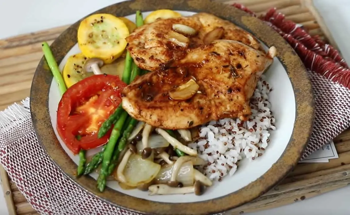 Pan-fried chicken breast with red pepper rice